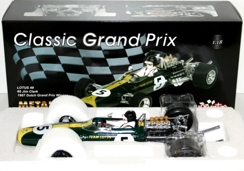 :18 Green and yellow Lotus 49 No. 5 die-cast race car in an open foam insert, with exposed engine and black tires.