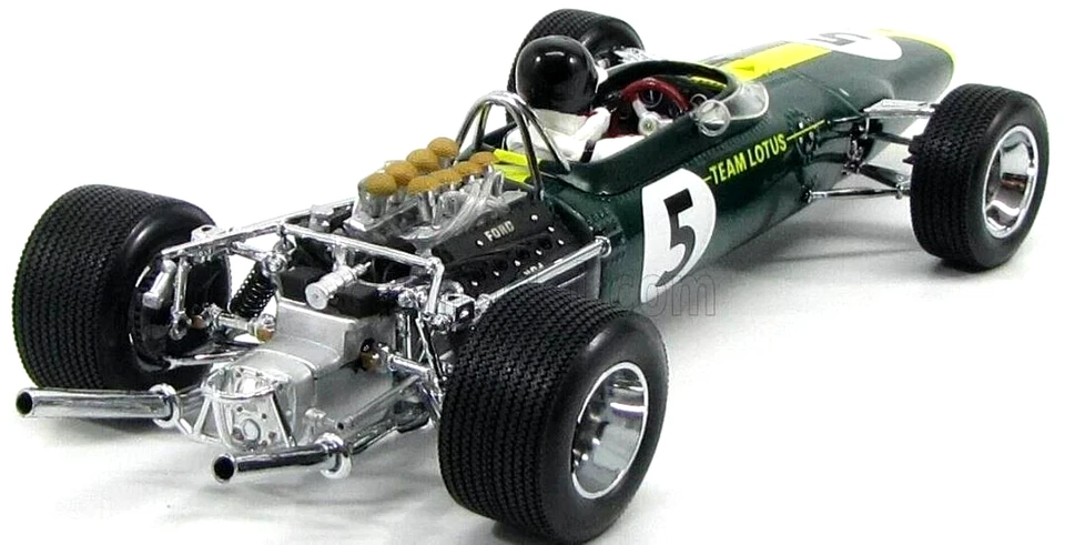 Green Formula Race Car Model Green open-wheel race car model with number 5, exposed rear engine, black tires, and a driver figure.