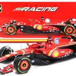 Red Ferrari Formula racing model car with black tires and sponsor decals, shown before a red branded display box.