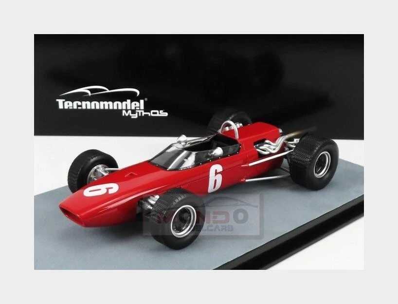 Red open-wheel Formula race car model with white number 6, black tires, and exposed silver engine pipes.